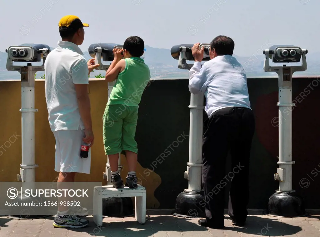 DMZ Zone (South Korea): tourists watching North Korea with binoculars from the South Korean base of Dora Observatory