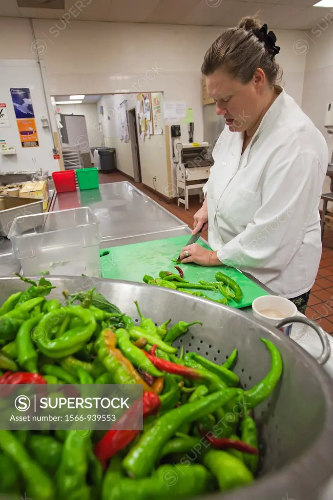 Detroit, Michigan - Chef Alison Costello processes produce at the Capuchin Soup Kitchen  The produce is grown at the Capuchins´ own garden, Earthworks...