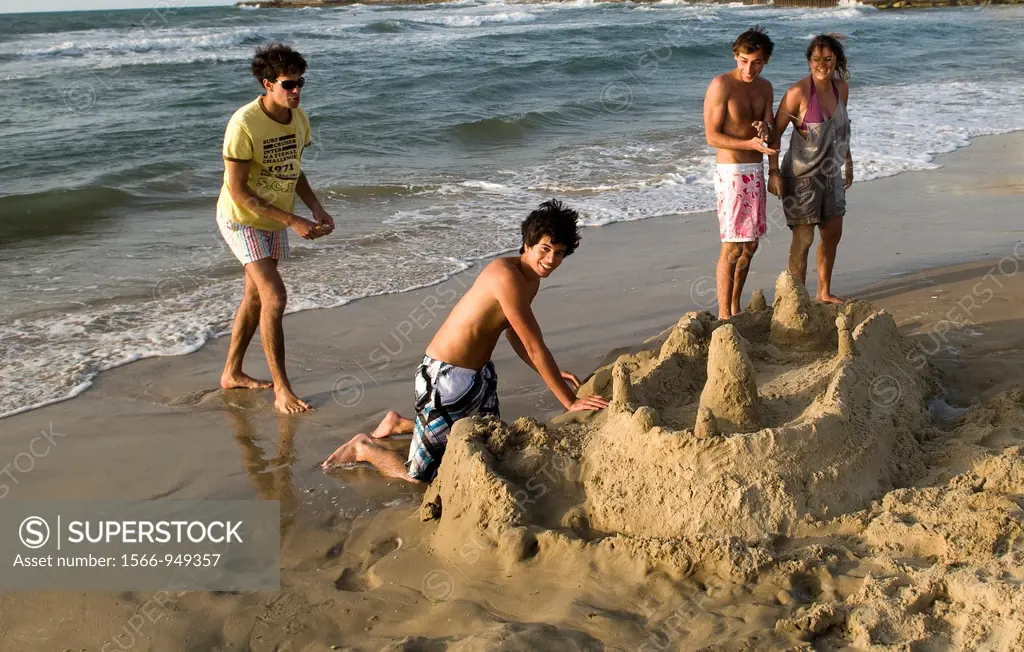 Israeli teenagers playing on the beach in Tel Aviv.