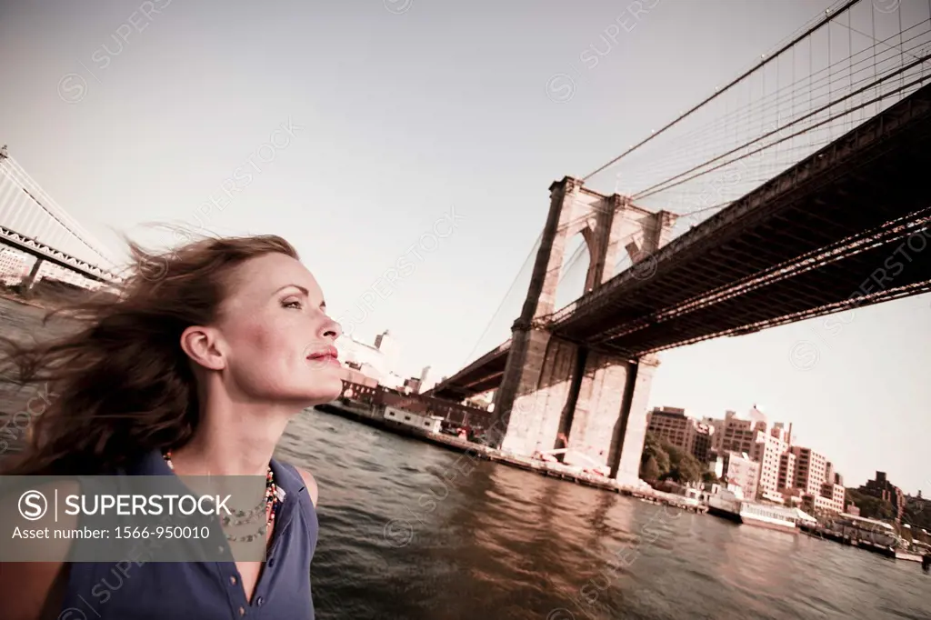 Young woman on a ferryboat, Manhattan, New York, USA
