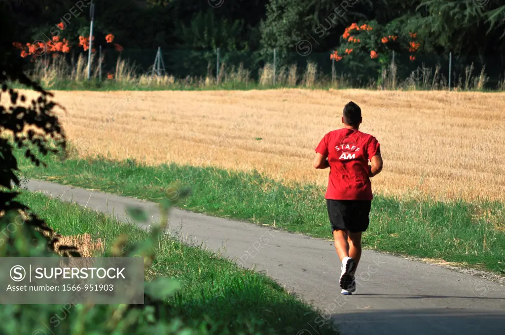Bazzano (Bologna, Italy): a man jogging in the countryside