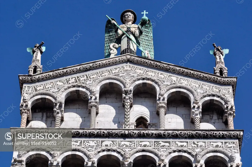 Lucca (Italy): detail of San Michele in Foro Churchs façade, with Archangel Micheles statue