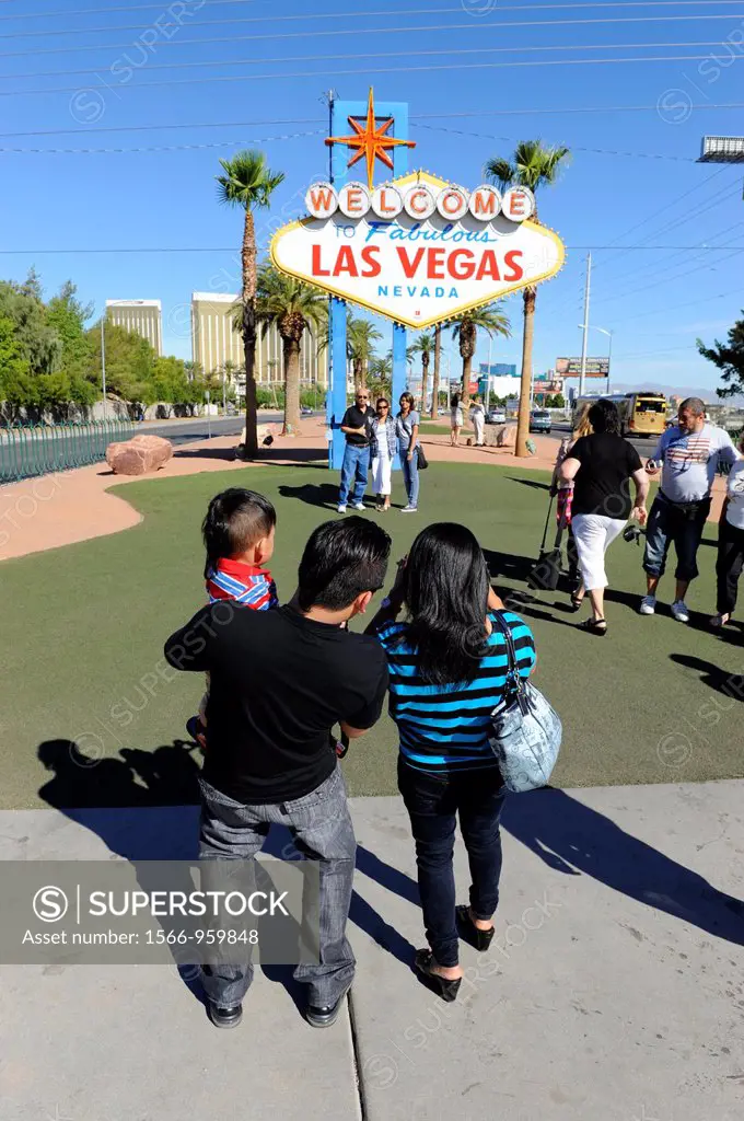 Visitors take picture with Welcome Sign Las Vegas Nevada Sin City Gambling Capital NV