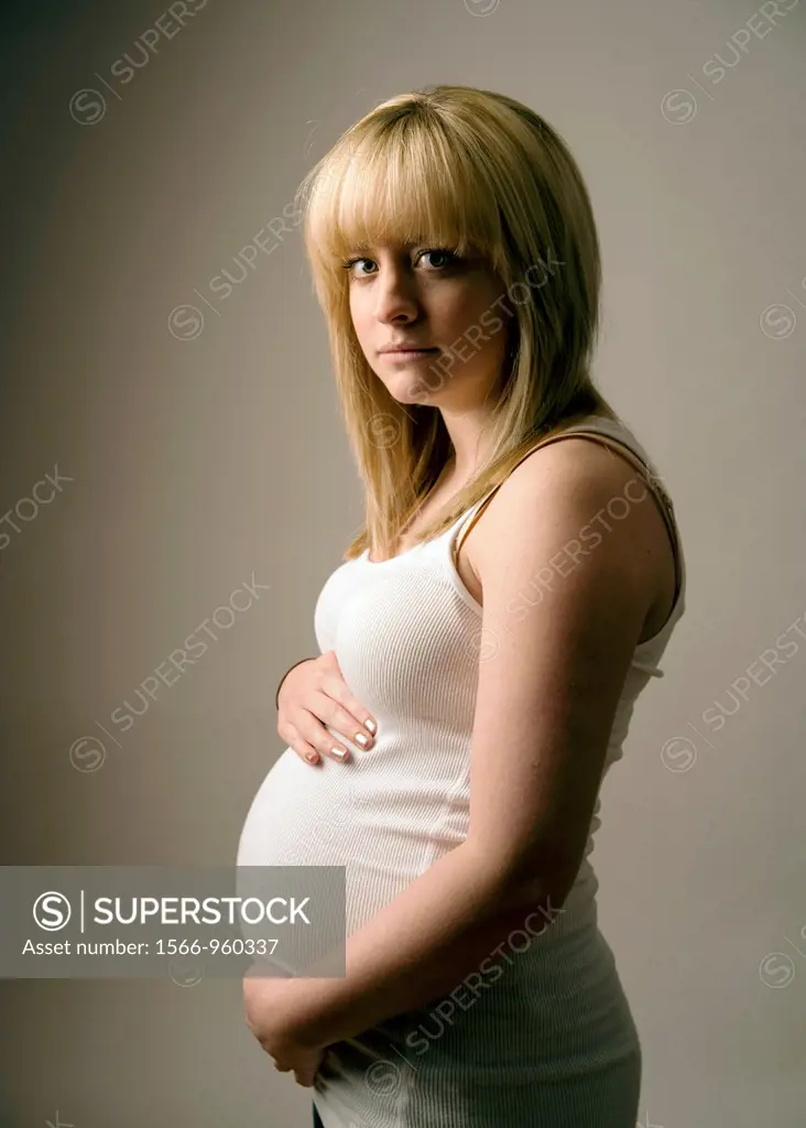 a pregnant young teenage blonde haired girl woman