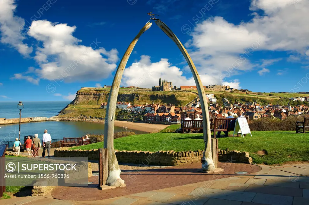 Whale Bone arch overlooking Whitby harbour with Whitby Abbey on the headland  Whitby, North Yorkshire, England