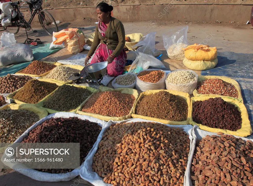 India, Delhi, Old Delhi, street market, dried fruit vendor.