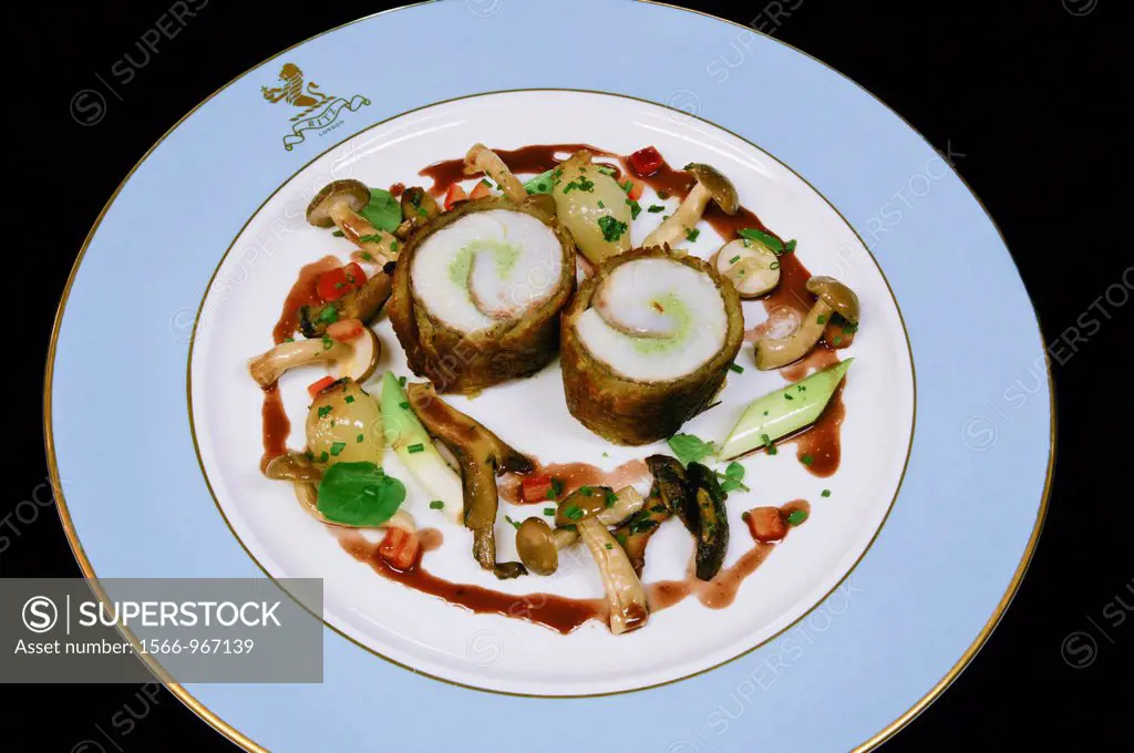 Paupiette of black sea bass rolled in a crispy potato with braised leeks and barolo wine sauce  The Ritz restaurant  London England  United Kingdom  U...