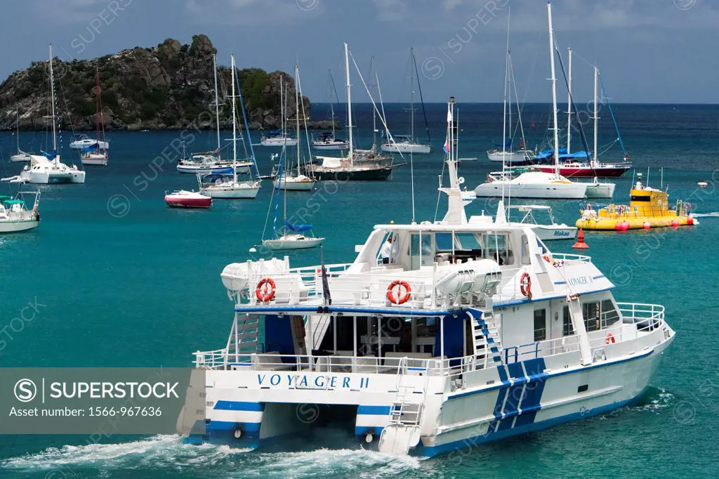 Voyager catamaran ferry leaves Gustavia port St Barts for neighboring St Martin