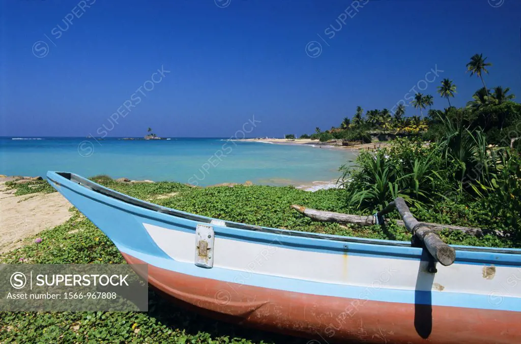 Beach and local fishing boat, Hikkaduwa, Sri Lanka