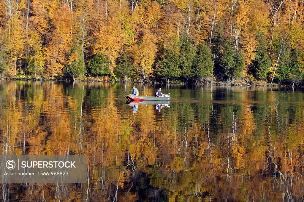 Craftsbury Vermont VT colorful fall foliage reflected in Lake Eligo, New England USA