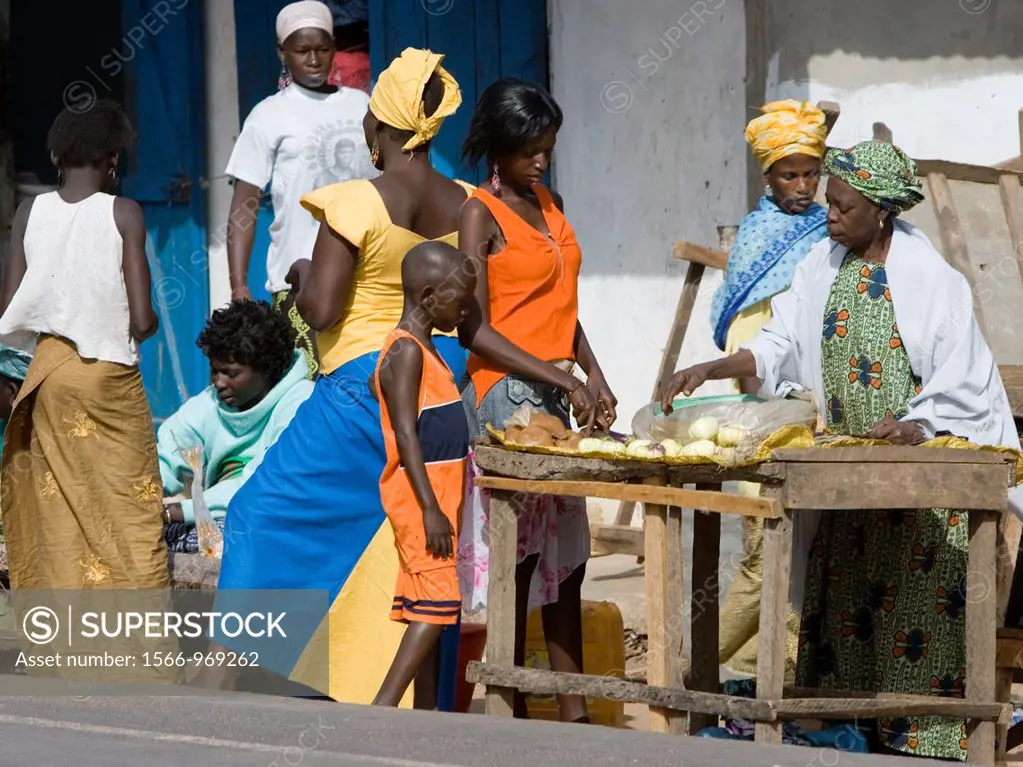 Women in traditional colorful clothes Sanyang open air street market The Gambia
