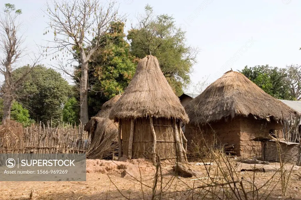 Traditional buildings and compound Batelling village near Tendaba Camp The Gambia