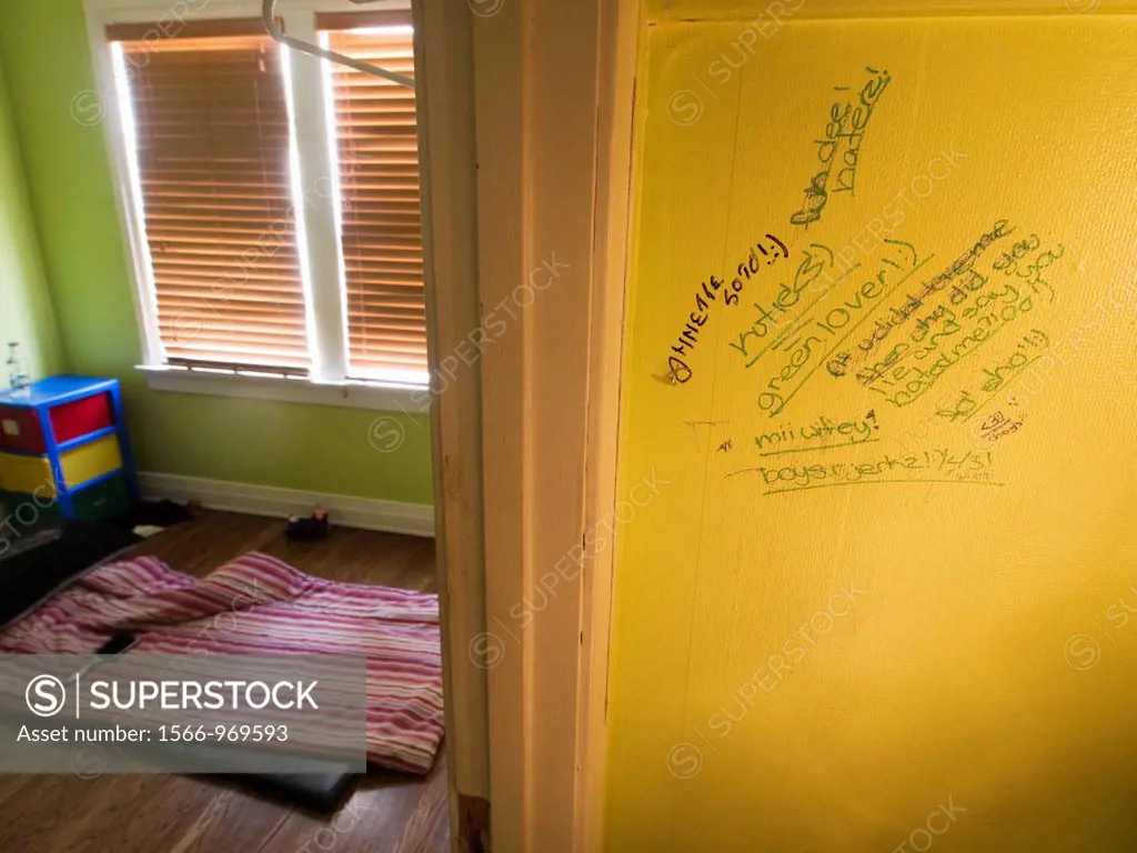 Writing on wall in child´s room in abandoned house in a foreclosed house in Huntington Park, California, United States