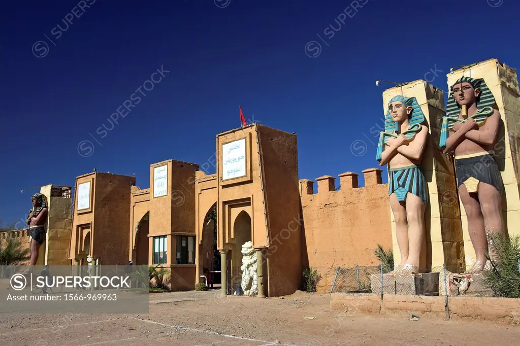 Pharaohs and figurines at entrance to Atlas Corporation film studios near Ouarzazate Morocco