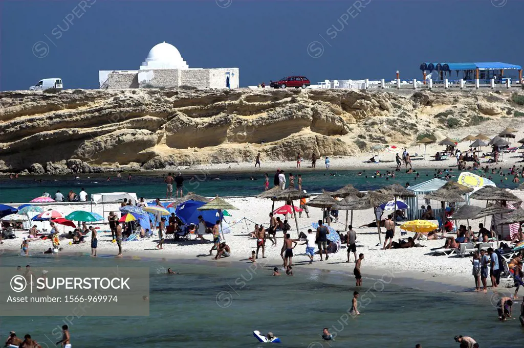 Holidaymakers bathe and cool off at Monastir Beach Tunisia