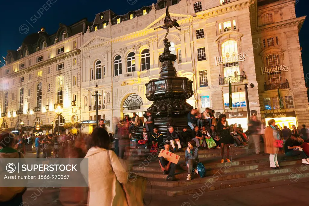People and Tourists in Piccadilly Circus With Eros Statue at night  Soho  London  England  United Kingdom  UK  Europe.