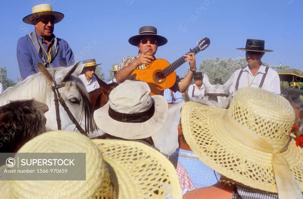 pilgrims singing near Doñana Palace,Romeria del Rocio, pilgrims on their way through the Doñana National Park, pilgrimage of Sanlúcar de Barrameda bro...