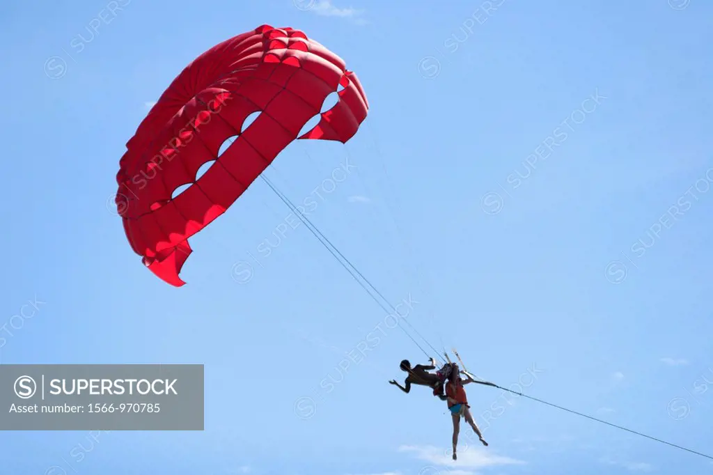 Instructor parasailing with flier Patong Beach after tsunami Phuket island Thailand