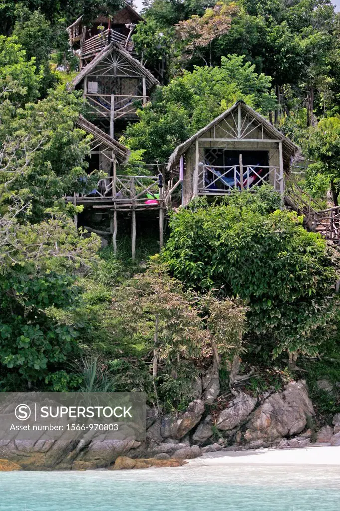 Wooden hillside bungalows on stilts at View Point Ko Lipe island Thailand