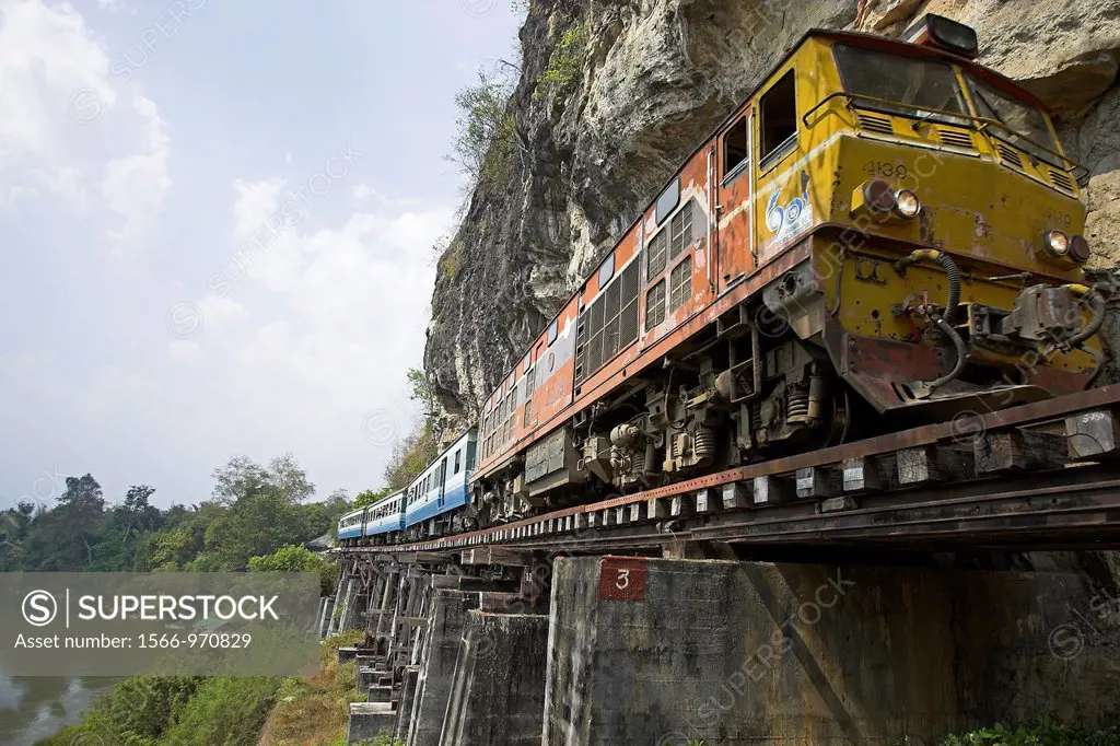 River Kwai and Burma Railway tourist train on Krasae Cave trestle railway viaduct bridge Thailand