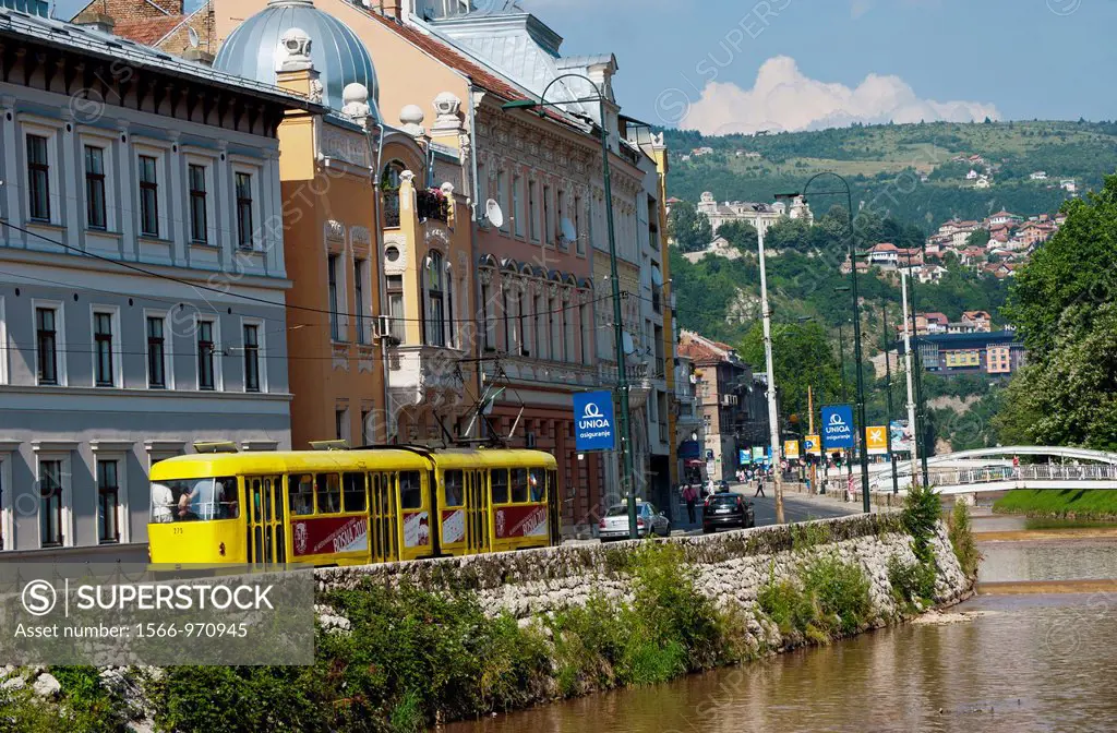 Tram along Obala Kulina Bana street and Miljacka river  Sarajevo Bosnia- Herzegovina  Balkans  Europe