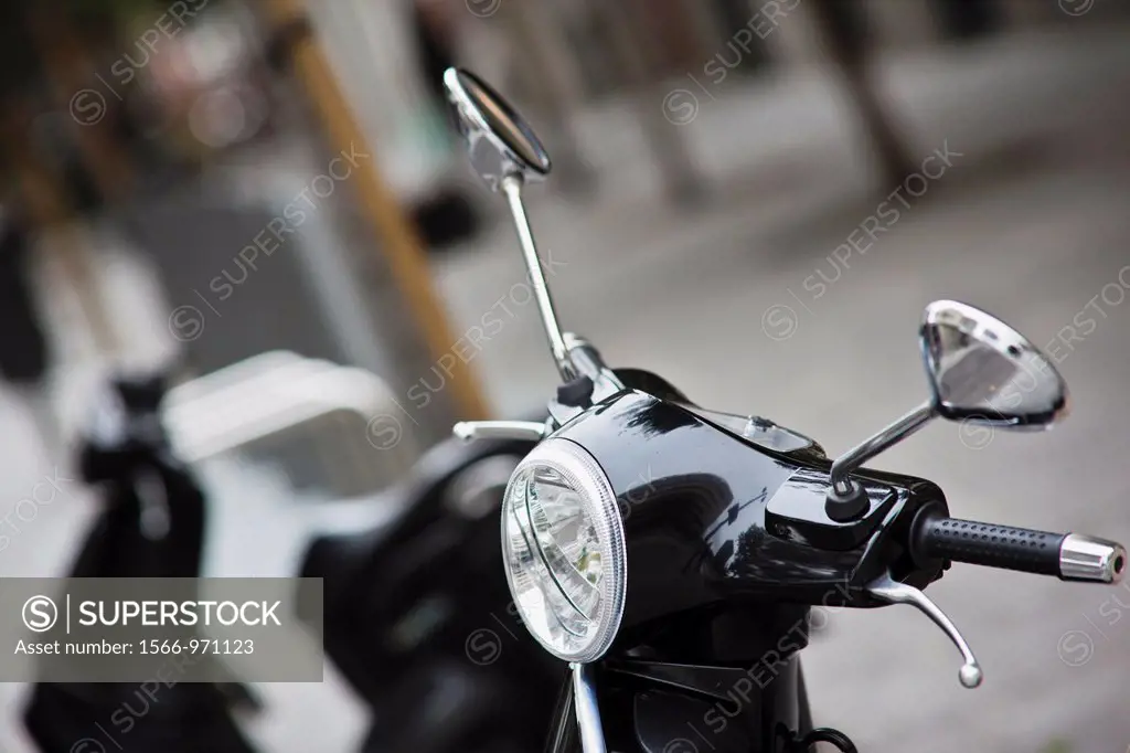 Spain, Madrid, Salamanca Area, Calle de Jose Ortega y Gasset, Madrid´s exclusive shopping street, black Vespa scooter