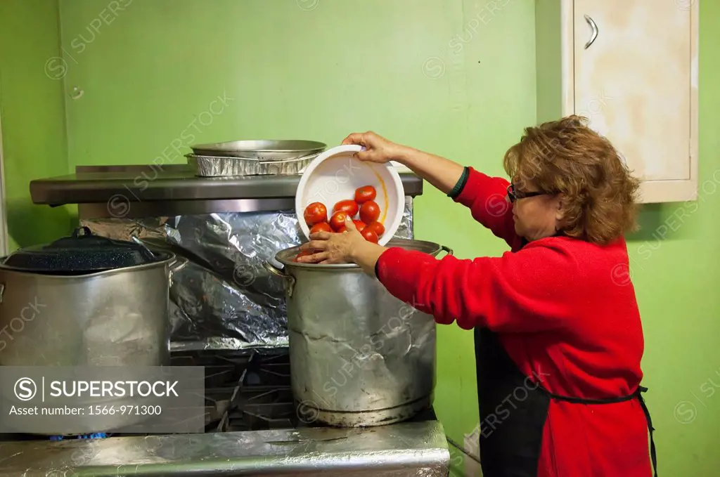 Nogales, Sonora, Mexico - Volunteers prepare meals at the Assistance Center for Deported Migrants  The Center provides food, clothing, and other assis...