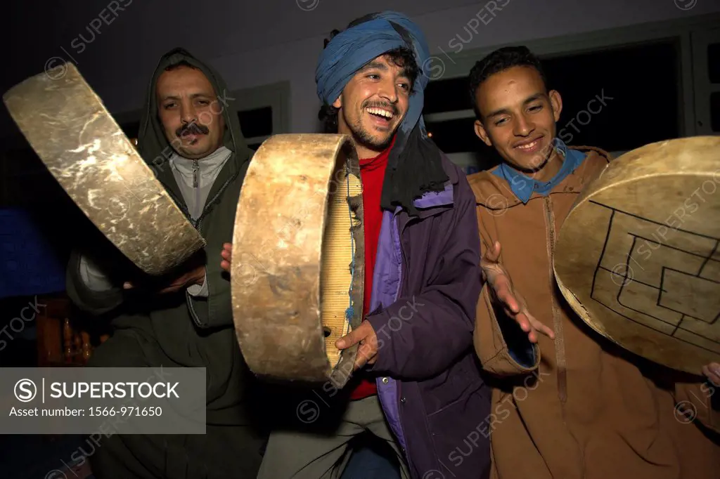 Berber men sing and play tambours Morocco