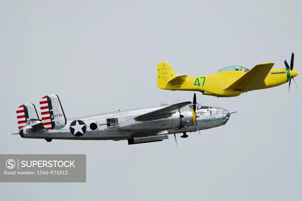Old WWII bomber plane North American B-25 J Mitchell ´Pacific Prowler´ in flying formation with fighter P-51 D Mustang ´Old Yeller´ modified for Reno ...