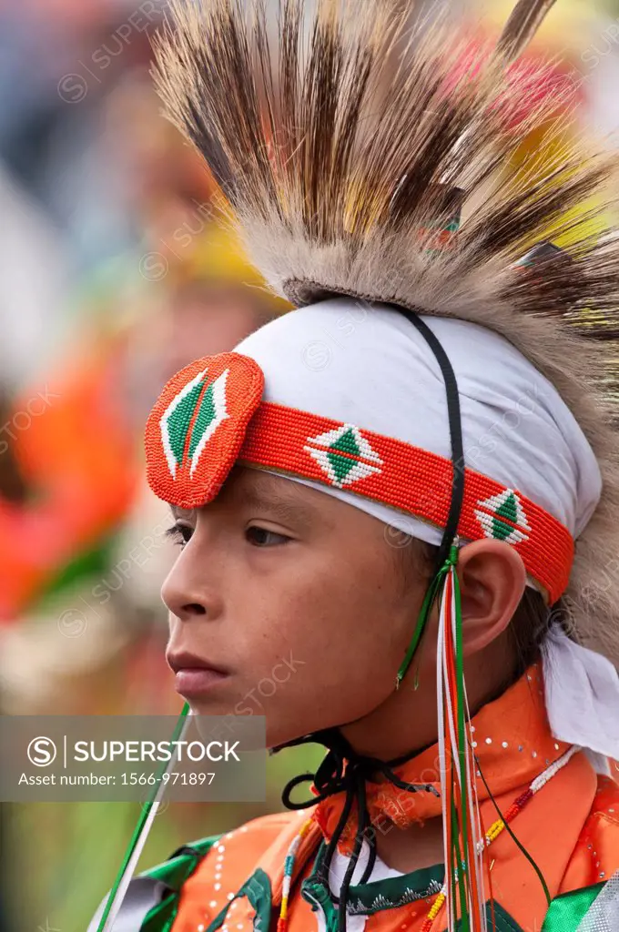 Young boy in traditional First Nations regalia, T´suu Tina Pow wow, Bragg Creek, Alberta, Canada