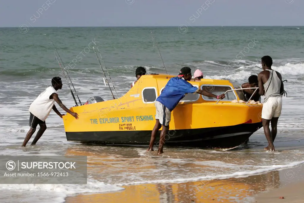Sport fishing boat brought ashore beach Kololi The Gambia