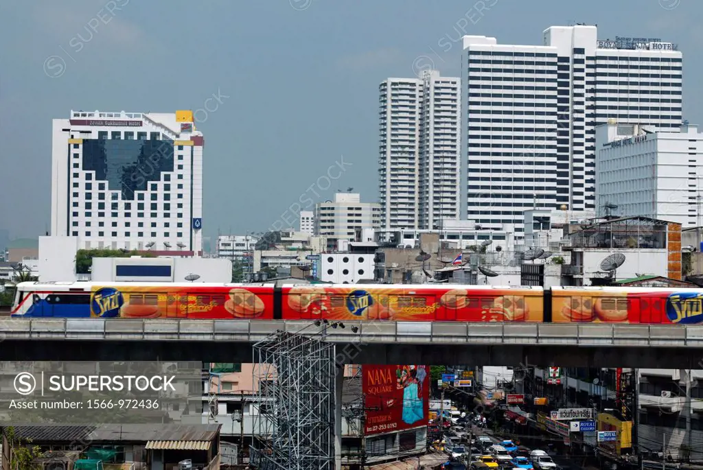 Sky Train glides above snarled traffic on Soi Sukhumvit Nana Nua Bangkok Thailand