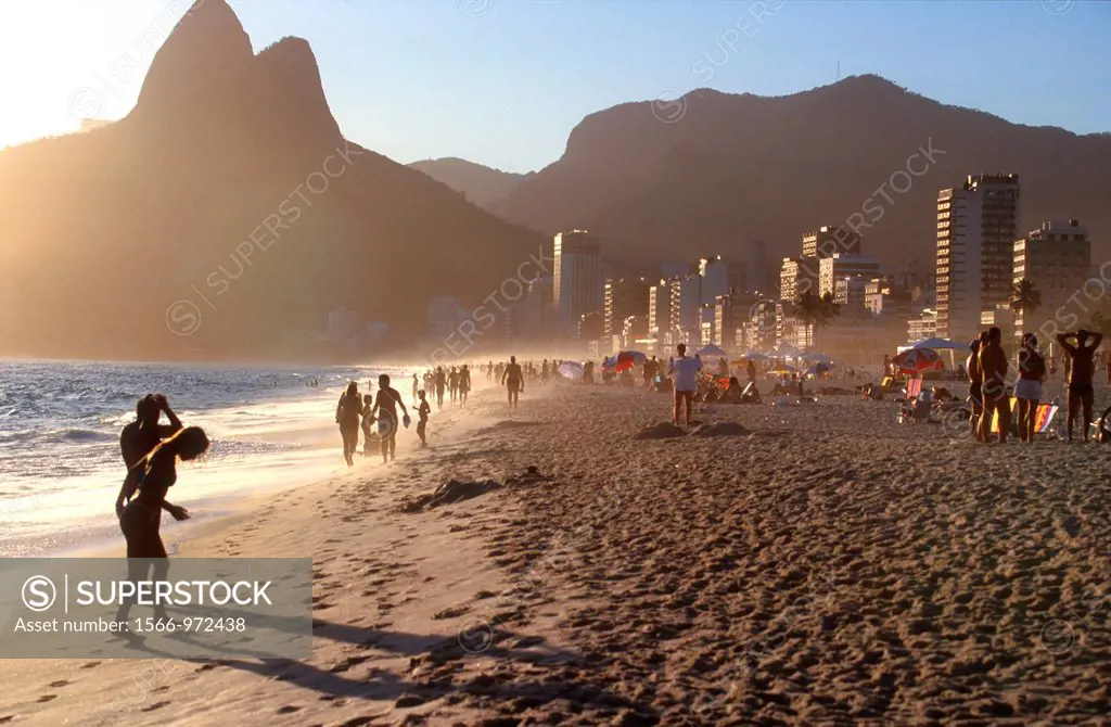 Sun setting, at two kilometre long Ipanema Beach, Rio de Janeiro, Brazil