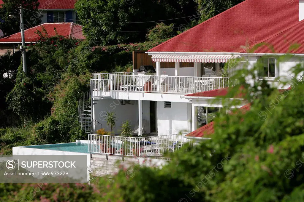 Luxury accommodation with balcony terrace and swimming pool overlooking Gustavia Harbour St Barts