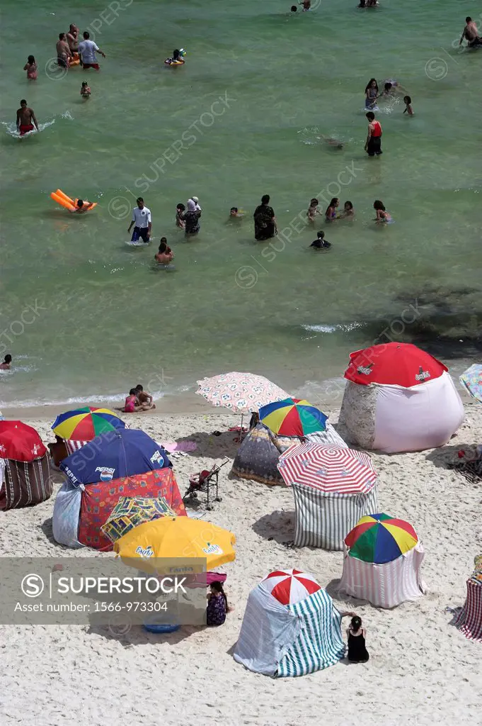 Holidaymaker sunshades and windbreaks line Boujaffar Beach Sousse Tunisia