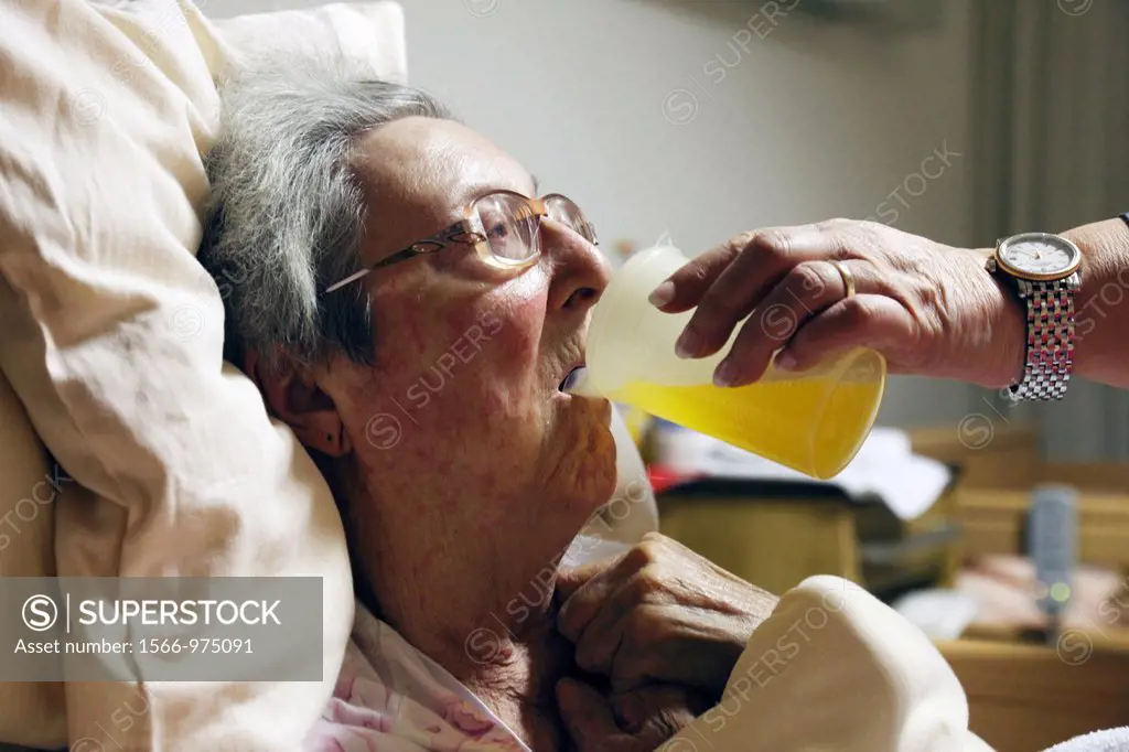 people, old age, retirement home, Altenzentrum der St Clemens Hospitale in Sterkrade, older woman lies in a sickbed, aged 70 to 85 years, physical han...
