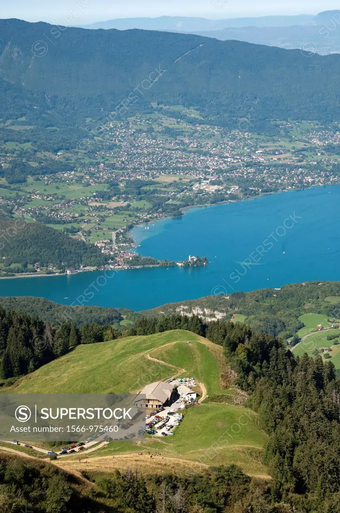 View across a farm Inn at the Aulp pass in the Bornes Mountains Massif des Bornes to the municipality of Duingt at the Lake of Annecy Lac d´Annecy, Ha...