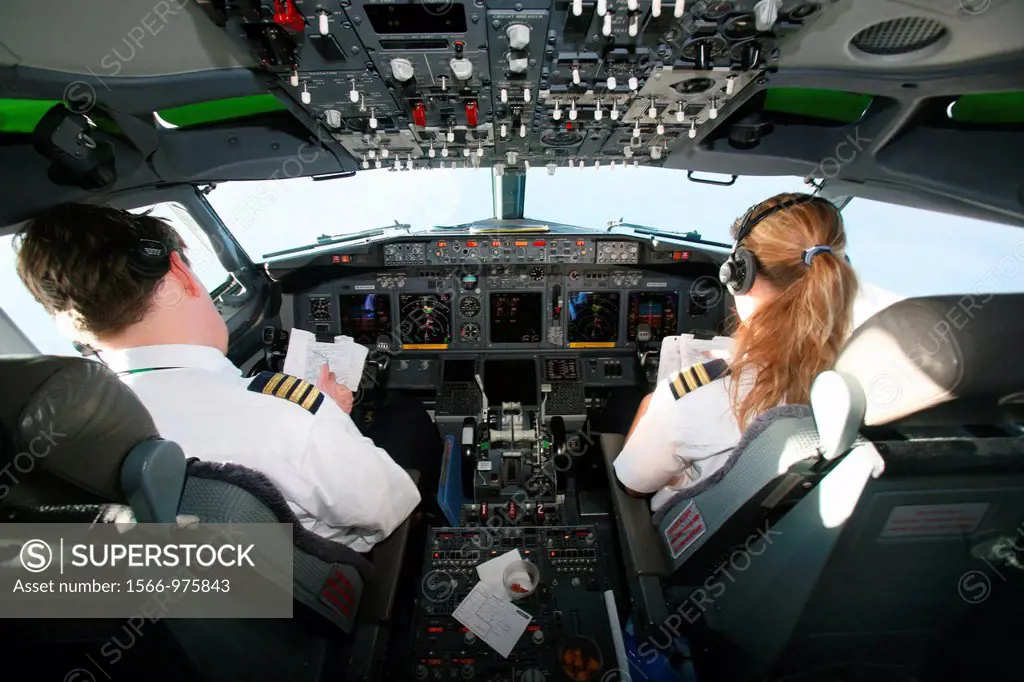 Pilot and co pilot working in a Boeing 737 editorial use only, no negative publicity