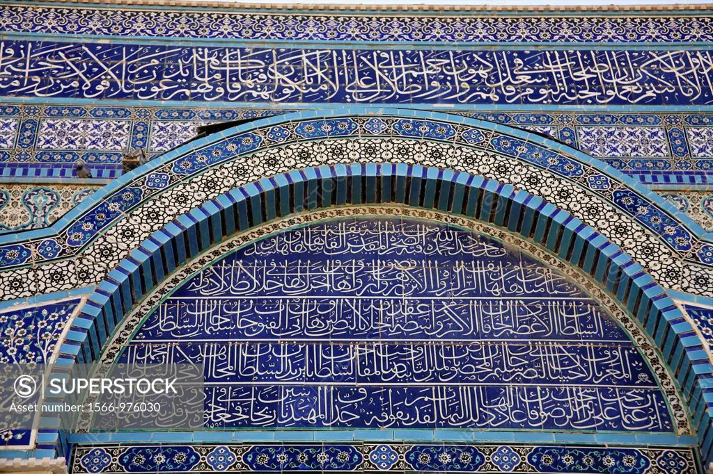 The mosaic exterior of the Dome of the Rock on Temple Mount in the Old City of Jerusalem Closeup of Arabic script on the building