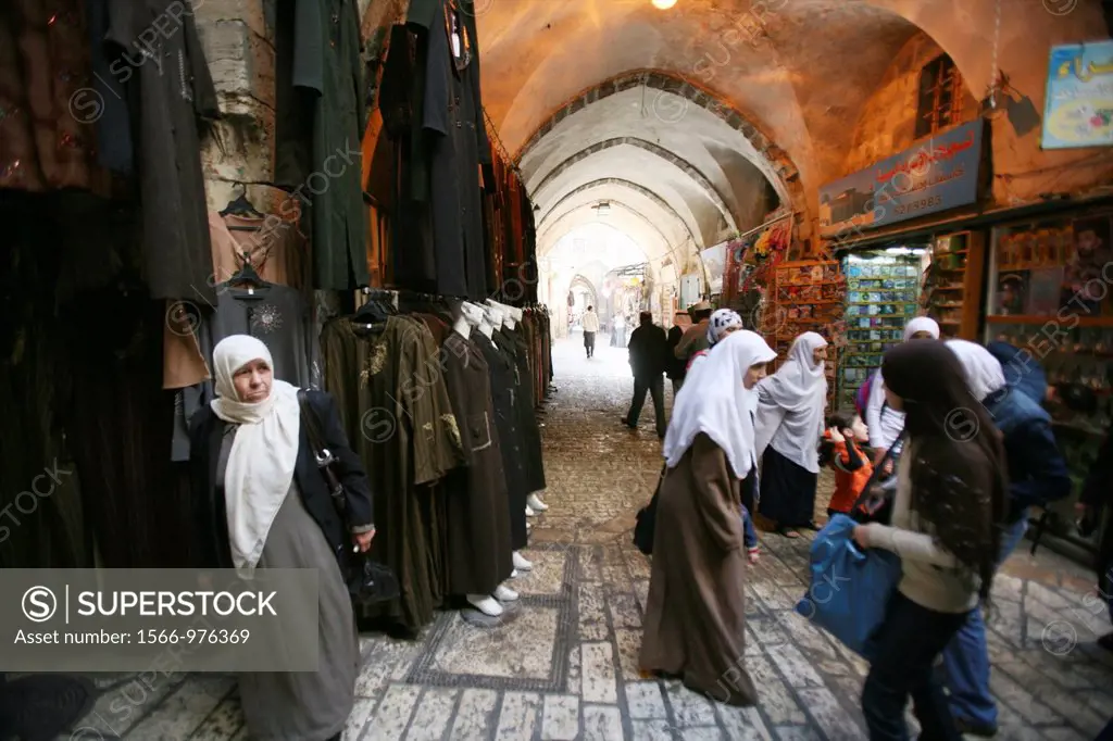 Muslim women shop at a market in the old city section of Jerusalem