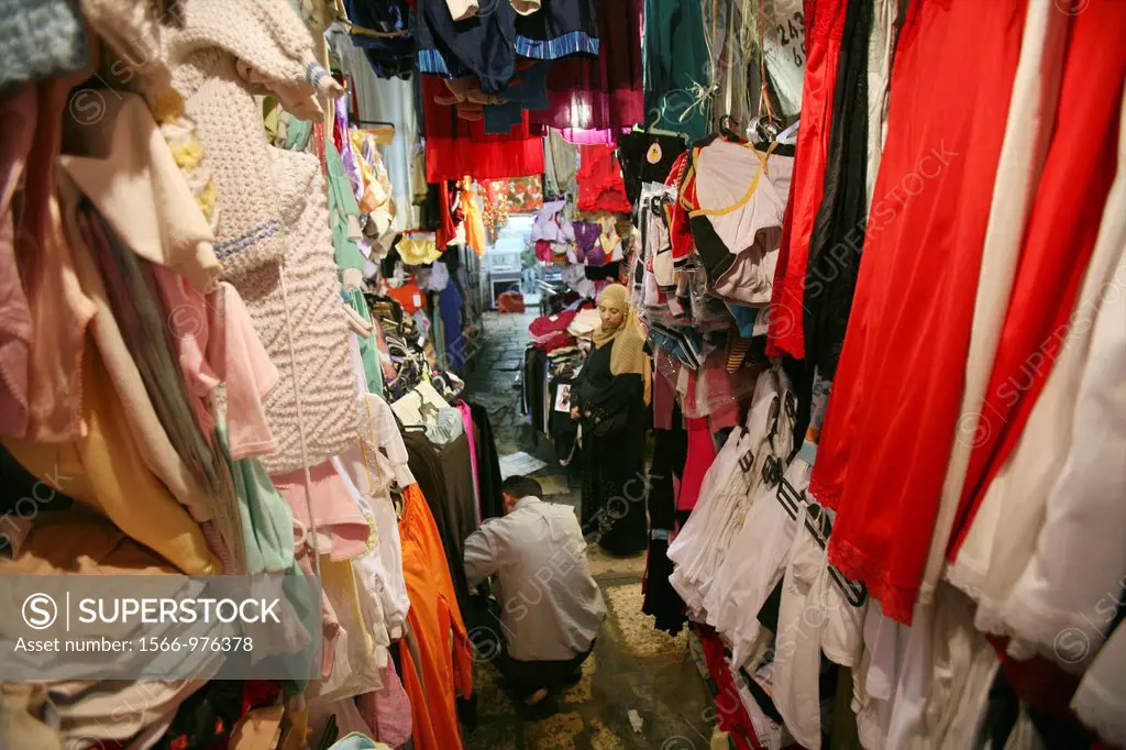 Material, linen and clothes for sale at a market in the old city section of Jerusalem