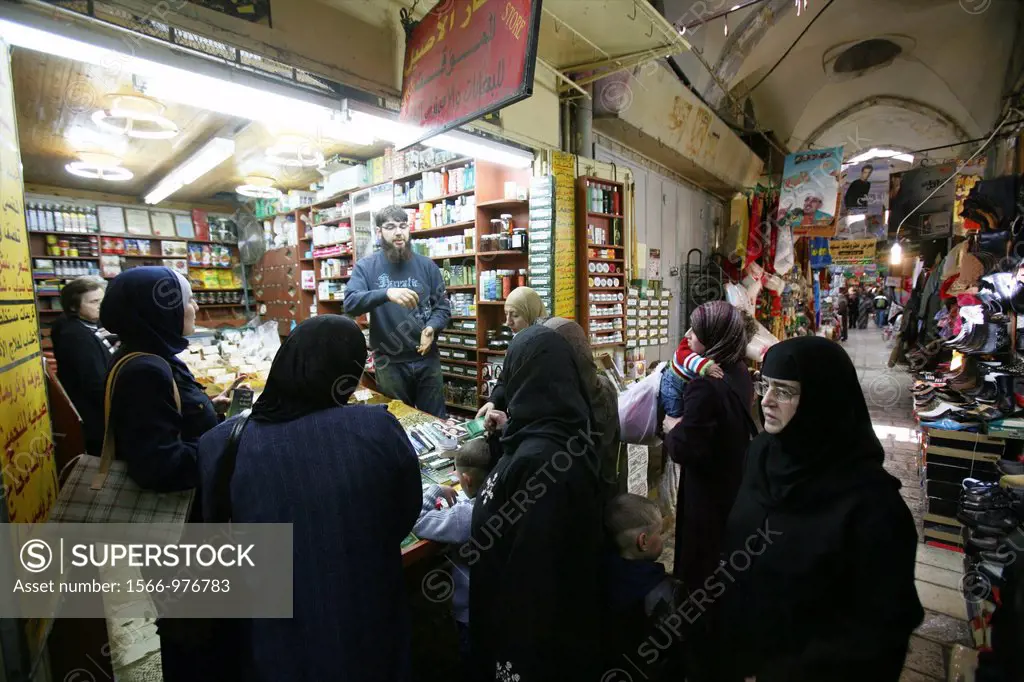 Muslim women at a crowded store at a market in the old city section of Jerusalem