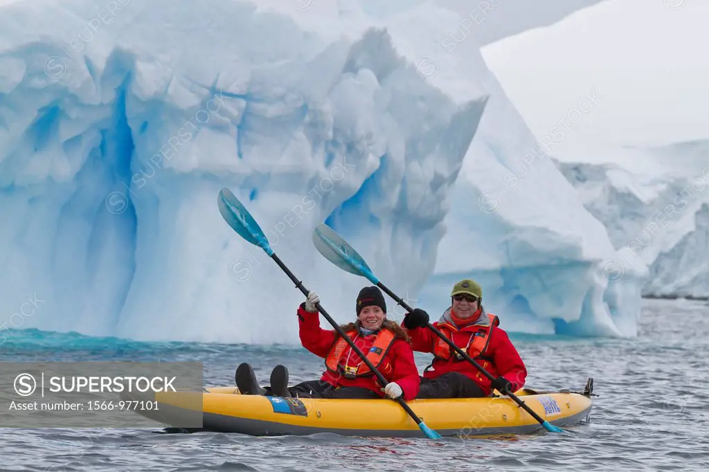 Guests from the Lindblad Expedition ship National Geographic Explorer enjoy Dorian Bay in Antarctica by kayak
