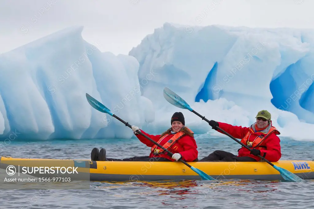 Guests from the Lindblad Expedition ship National Geographic Explorer enjoy Dorian Bay in Antarctica by kayak