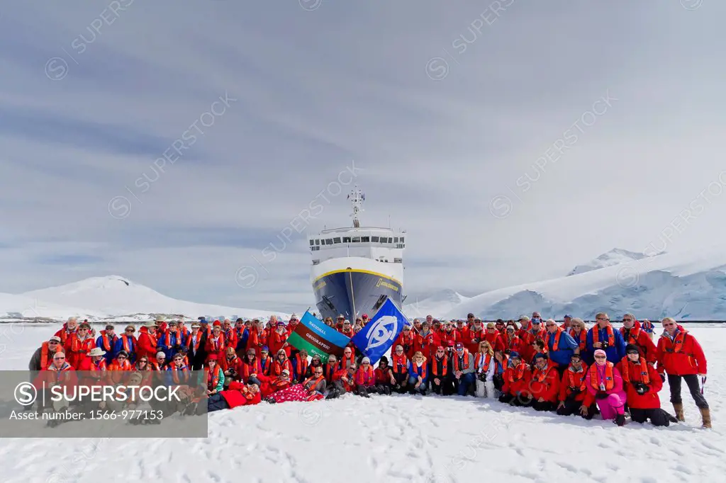 Guests from the Lindblad Expedition ship National Geographic Explorer gather on sea ice in Antarctica