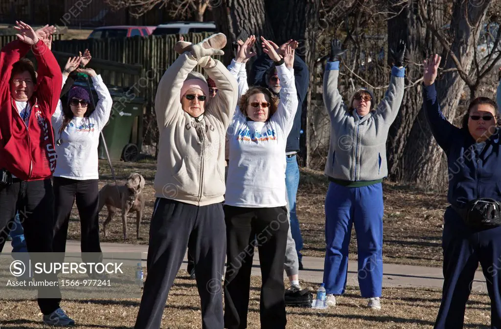 Centennial, Colorado - Participants in the ´Walk with a Doc´ exercise program stretch before walking in DeKoevend Park  The program was organized by a...