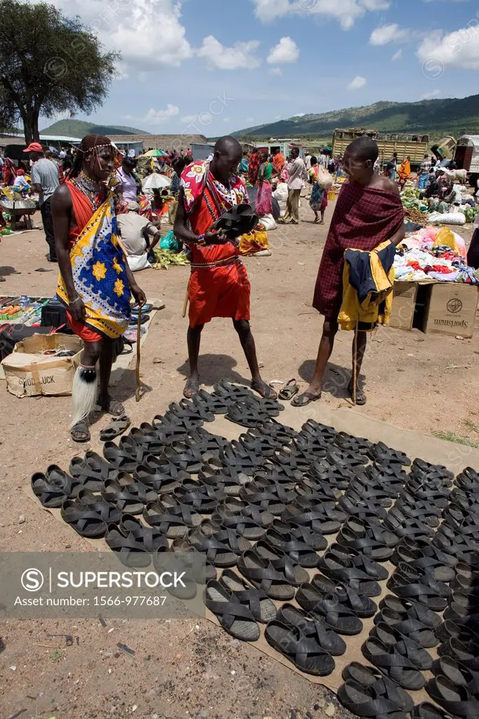 Weekly open air market in South kenya, bordering game park ´Maasai Mara´, inhabited by the massai ethnic tribe Shoes are made from old tyres ands fo...
