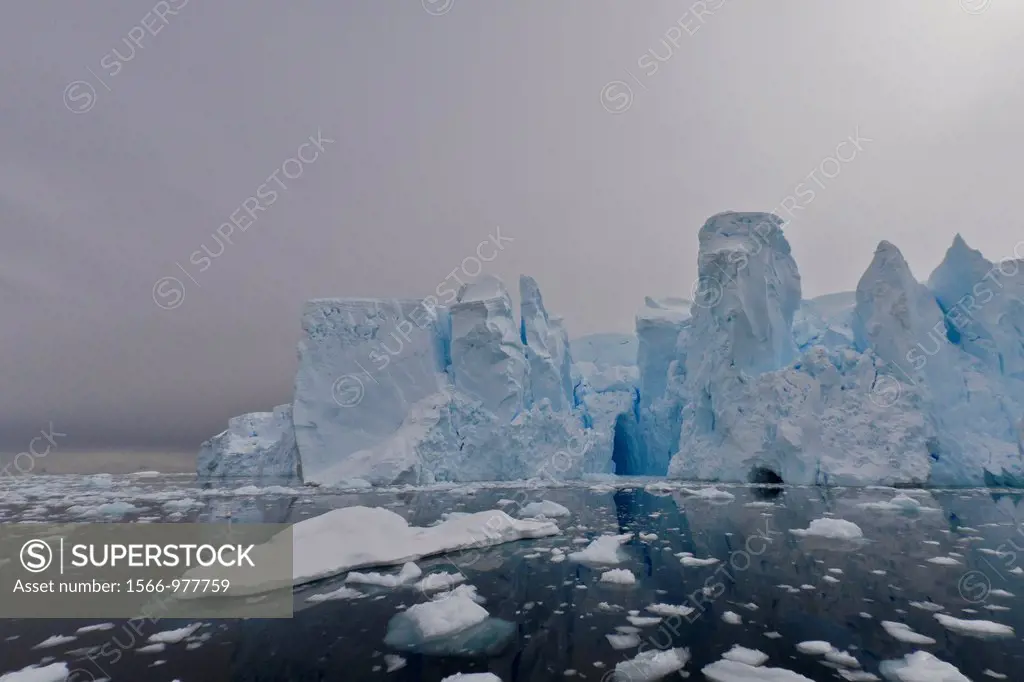 View of tidewater glacier caves found deep inside Neko Harbor on the western side of the Antarctic Peninsula, Southern Ocean