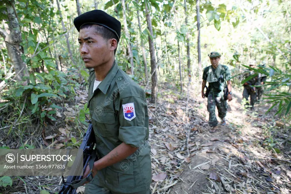 KNLA soldiers patrolling near the border with Thailand In Myanmar Burma, thousands of people have settled near the border as a result of oppression in...