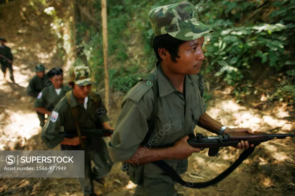 KNLA soldiers in the jungle near La Per Her In Myanmar Burma, thousands of people have settled near the border as a result of oppression in their home...